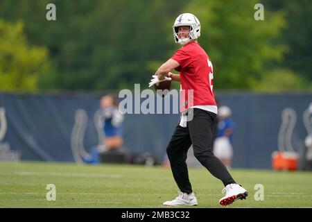 FILE - Indianapolis Colts quarterback Matt Ryan holds up his new jersey  following a press conference at the NFL team's practice facility in  Indianapolis on March 22, 2022. After four straight losing