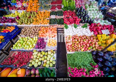 All kinds of fruits and vegetables are displayed for sale in the local Ballaro market. Stock Photo