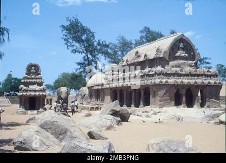 The Shore Temple is a complex of temples and shrines that overlooks the shore of the Bay of Bengal. It is located in Mahabalipuram, about 60 kilometres south of Chennai in Tamil Nadu, India. It is a structural temple, built with blocks of granite, dating from the 8th century AD. The site has 40 ancient monuments and Hindu temples, including Descent of the Ganges or Arjuna's Penance – one of the largest open-air rock relief in the world. The complex consists of three separate shrines: two dedicated to the god Shiva, and one to Vishnu. Stock Photo