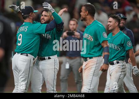 Seattle Mariners' Eugenio Suarez holds a trident as he celebrates