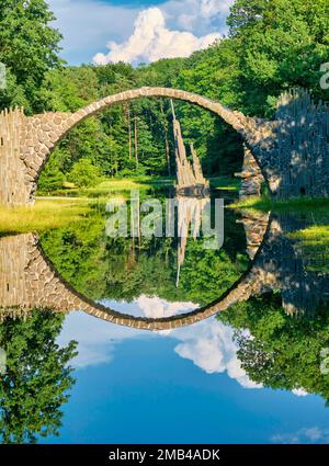 Rakotz Bridge, also Devil's Bridge, and basalt columns, the organ, in the Azalea and Rhododendron Park Kromlau, Gablenz, Saxony, Germany Stock Photo