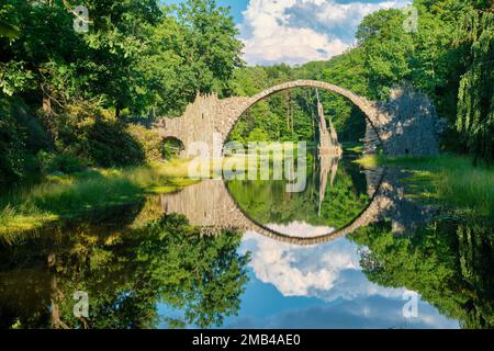 Rakotz Bridge, also Devil's Bridge, and basalt columns, the organ, in the Azalea and Rhododendron Park Kromlau, Gablenz, Saxony, Germany Stock Photo