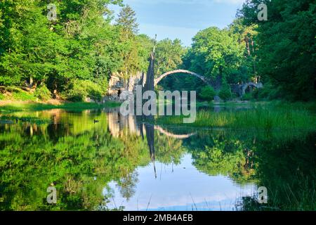 Rakotz Bridge, also Devil's Bridge, and basalt columns, the organ, in the Azalea and Rhododendron Park Kromlau, Gablenz, Saxony, Germany Stock Photo