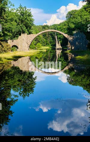 Rakotz Bridge, also Devil's Bridge, and basalt columns, the organ, in the Azalea and Rhododendron Park Kromlau, Gablenz, Saxony, Germany Stock Photo