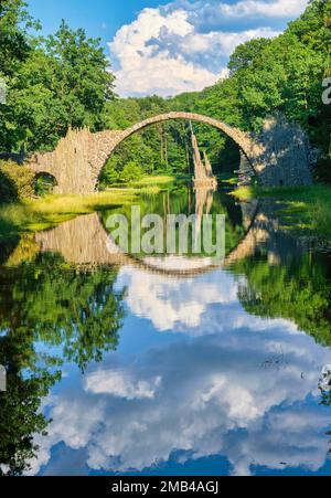 Rakotz Bridge, also Devil's Bridge, and basalt columns, the organ, in the Azalea and Rhododendron Park Kromlau, Gablenz, Saxony, Germany Stock Photo