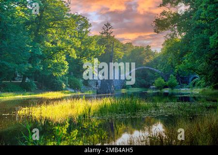 Rakotz Bridge, also Devil's Bridge, and basalt columns, the organ, in the Azalea and Rhododendron Park Kromlau, Gablenz, Saxony, Germany Stock Photo