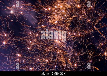 Fireworks in the night sky. Thousands of exploding colors and lights tear the sky. Stock Photo