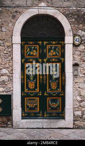 Artfully painted door, old town of Taormina, Sicily, Italy Stock Photo
