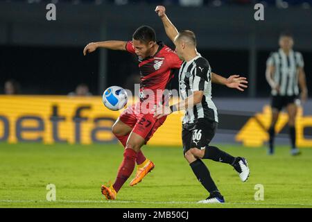 Ze Ivaldo of Brazil's Athletico Paranaense heads the ball in an attempt to  score as Diego Viera of Paraguay's Libertad challenges him during a Copa  Libertadores round of sixteen second leg soccer