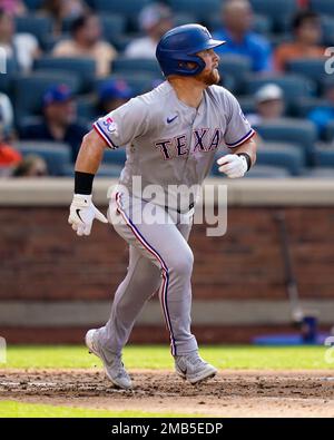 Texas Rangers' Kole Calhoun hits against the Arizona Diamondbacks during  the first inning of a spring training baseball game Tuesday, March 22,  2022, in Scottsdale, Ariz. (AP Photo/Matt York Stock Photo - Alamy