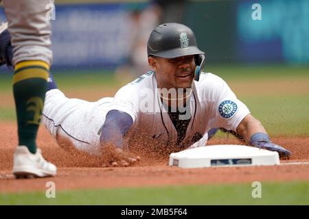 Seattle Mariners third baseman Eugenio Suarez throws to first base against  the Detroit Tigers in a baseball game, Saturday, July 15, 2023, in Seattle.  (AP Photo/Lindsey Wasson Stock Photo - Alamy