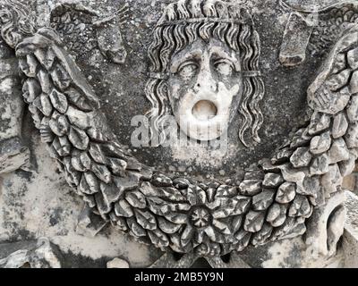 bas-relief of the female head of the Gorgon Medusa on the sarcophagus in the ancient city of Hierapolis, Turkey. Stock Photo