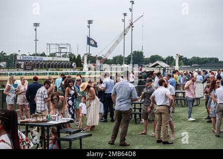 More than 150 Airmen, friends and family members attend Military Appreciation Day at Churchill Downs in Louisville, Ky., June 12, 2022, to honor Tech. Sgt. Travis Brown, a pararescueman from the Kentucky Air National Guard’s 123rd Special Tactics Squadron who died Feb. 16. One of the races on the day's card was named in honor of Brown and concluded with eight of his fellow 123rd STS Airmen presenting the trophy. Stock Photo