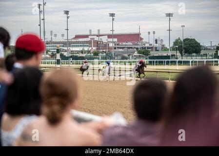 More than 150 Airmen, friends and family members attend Military Appreciation Day at Churchill Downs in Louisville, Ky., June 12, 2022, to honor Tech. Sgt. Travis Brown, a pararescueman from the Kentucky Air National Guard’s 123rd Special Tactics Squadron who died Feb. 16. One of the races on the day's card was named in honor of Brown and concluded with eight of his fellow 123rd STS Airmen presenting the trophy. Stock Photo