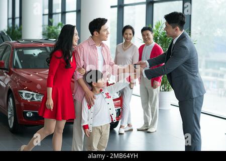 A family of choose and buy car Stock Photo