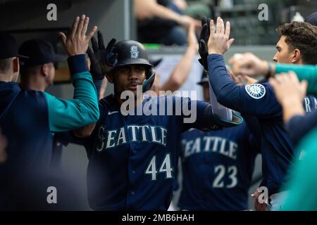 Seattle Mariners' Mitch Haniger wearing the home run helmet in the dugout  after hitting a solo home run against the Detroit Tigers during a baseball  game, Wednesday, Oct. 5, 2022, in Seattle. (