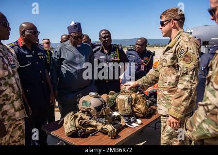 U.S. Air Force Pararescuemen (right) assigned with the 131st Rescue Squadron, California Air National Guard show various safety equipment used during a rescue mission to members of the Nigerian Ministry of the Interior, Minister of Defense, Nigeria Security & Civil Services, and  Federal Fire Service during a State Partnership visit at the 129th Rescue Wing, Moffett Air National Guard Base, California, June 13, 2022. The purpose of SPP is to enhance military ties and strengthen partnerships with nations around the world. Stock Photo