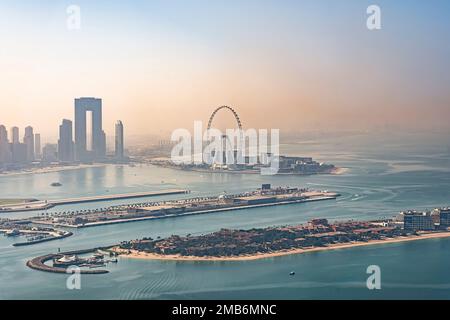 Amazing view of the Ain Dubai in the evening. the city of murom in the fog. top view of the dubai marina shore. view at the palm Stock Photo