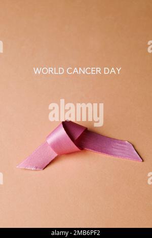 Pink ribbon breast cancer on pink background with copy space for text. Flat  lay, top view Stock Photo - Alamy
