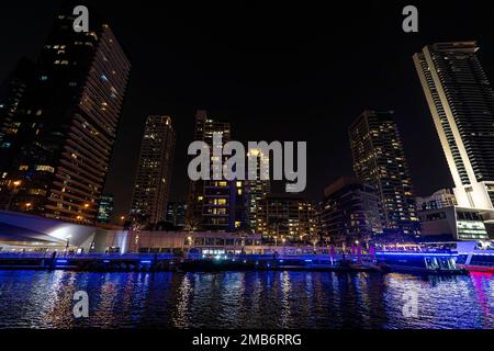 Dubai marina skyscrapers during night hours. Beautiful night view of skyscrapers in Dubai Marina. Stock Photo