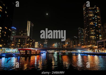 Dubai marina skyscrapers during night hours. Beautiful night view of skyscrapers in Dubai Marina. Stock Photo