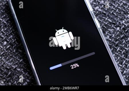 Android mobile phone during system update Stock Photo