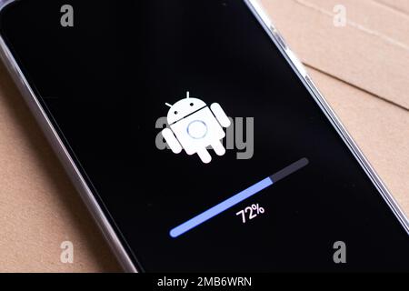 Android mobile phone during system update Stock Photo