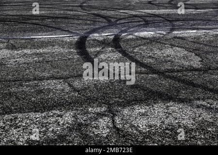 Detail of wheel marks on a mountain road, clandestine car race Stock Photo
