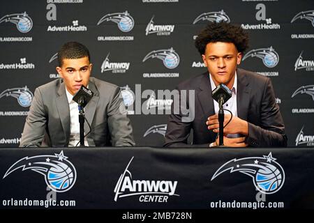 Orlando Magic draft picks forward Caleb Houstan (2) and forward Paolo  Banchero (5) show off their new jerseys during a news conference for the NBA  basketball team, Friday, June 24, 2022, in