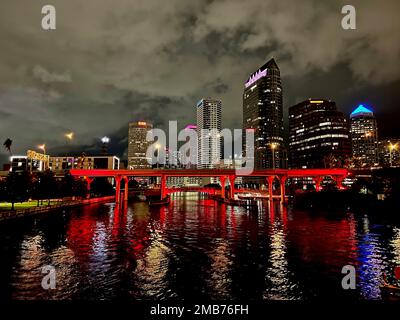 The Riverwalk Bridge lit up in red at night, downtown Tampa Stock Photo