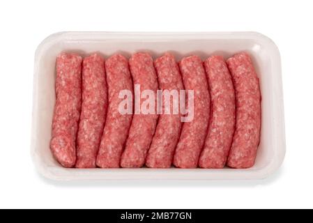 Raw turkey and pork meat sausage in food plastic tray for sale in supermarket, isolated on white with clipping path included Stock Photo