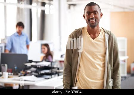 Innovative and ambitious. A handsome indian man standing in the office alongside copyspace. Stock Photo