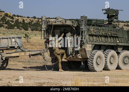 A soldier assigned to Bravo Company, 52nd Brigade Engineer Battalion, 2nd Stryker Brigade Combat Team, 4th Infantry Division, enters the hatch of an M1132 Engineer Squad Vehicle during engineer qualification tables, June 14, 2022, at Ft. Carson, Colo. Engineer qualification tables allow soldiers in the unit to demonstrate their proficiency at engineer tasks. U.S. Army photo by Maj. Jason Elmore. Stock Photo