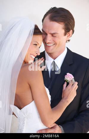 The perfect match. A happy newlywed couple sharing a tender moment. Stock Photo