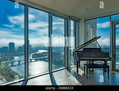 Grand Piano in luxury apartment overlooking Austin, TX skyine with Ladybird Lake. Stock Photo