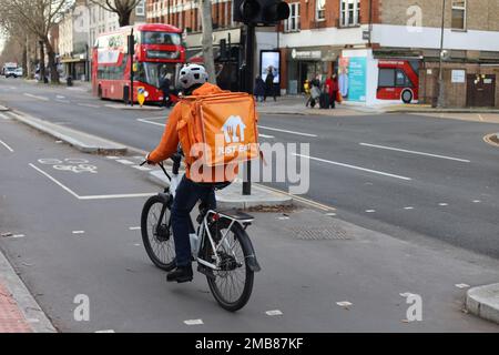 London - Just Eat delivery cyclist riding in cycle lane. Credit: Sinai Noor/Alamy Stock Photo
