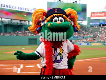 Boston Red Sox mascot Tessie The Green Monster performs on the infield  before a spring training baseball game against the Baltimore Orioles on  Thursday, March 17, 2016, in Fort Myers, Fla. (AP