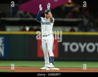 Seattle Mariners' Sam Haggerty, from left, celebrates with Jarred Kelenic  and Mitch Haniger after the Mariners defeated the Oakland Athletics in a  baseball game in Oakland, Calif., Thursday, Sept. 22, 2022. (AP