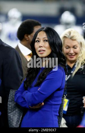 Buffalo Bills co-owner Kim Pegula, center, stands with others on the field  watching warmups before an NFL football game against the Dallas Cowboys in  Arlington, Texas, Thursday, Nov. 28, 2019. (AP Photo/Michael