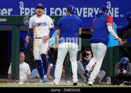 Texas Rangers left fielder Brad Miller (13) swings at a pitch