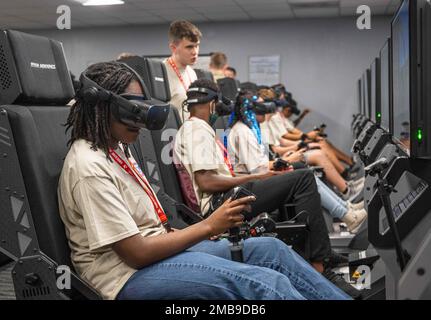 High School and middle schoolers attending the San Antonio ACE Academy fly immersive training devices at the 559th Flying Training Squadron June 13, 2022 at Joint Base San Antonio-Randolph. The San Antonio ACE Academy is part of the Organization of Black Aerospace Professionals, an organization that seeks to create pathways of success with diverse youth through education and mentorship in aviation career fields. 12FTW,99FTS,OBAP,Tuskegee Airmen, Stock Photo