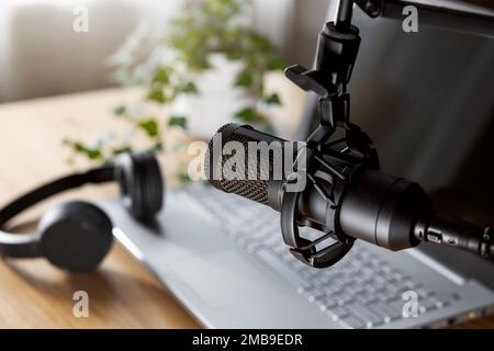 home studio for podcast recording, radio broadcasting. workplace of content creator. microphone closeup Stock Photo