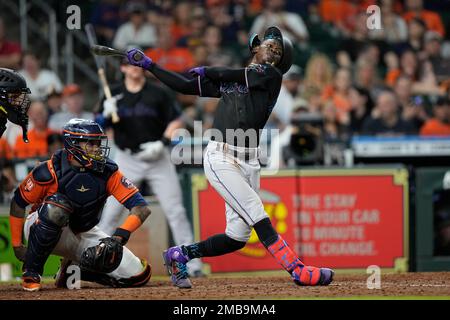 Miami Marlins' Jazz Chisholm loses his helmet as he runs to first