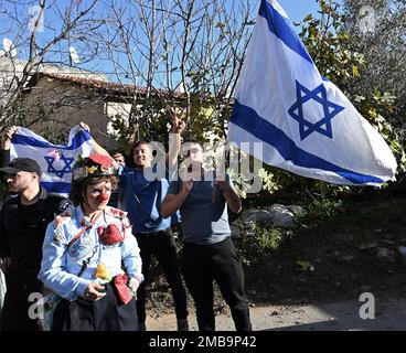 East Jerusalem, West Bank. 20th Jan, 2023. Right-wing Jews wave the Israel's national flag at a counter demonstration across from Israeli left-wing activists and Palestinians during a protest against Jewish settlements and home evictions in the Sheikh Jarrah neighborhood in East Jerusalem, on Friday, January 20, 202. Israeli police ignored orders from the new ultra-nationalist National Security Minister Itamar Ben Gvir to remove Palestinian flags in public. Photo by Debbie Hill/ Credit: UPI/Alamy Live News Stock Photo