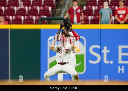 Cincinnati Reds left fielder Aristides Aquino (44) and second baseman Alejo  Lopez (35) attempt to catch a fly ball during the team's baseball game  against the Arizona Diamondbacks Tuesday, June 7, 2022