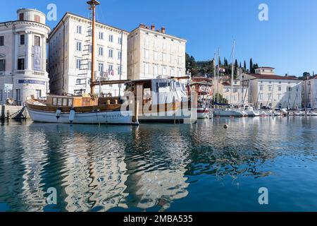 Beautiful old traditional wooden fishing boats at the tiny piran harbour in slovenia Stock Photo