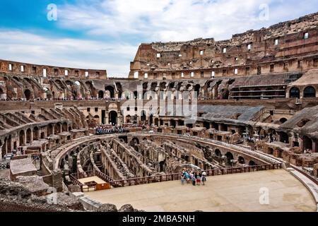 Rome, Italy - June 10, 2016:  Tourists inside the Colosseum in Rome.  It's an oval amphitheater in the center of the city. Stock Photo
