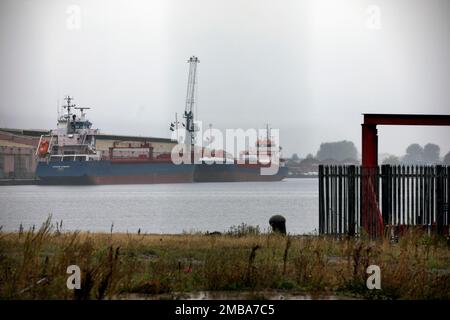 Looking across the East Float dock in Birkenhead, part of the Wirral Waters development on the banks of the river Mersey. Wirral Waters will form part of the Liverpool City Region Freeport, which was announced recently by the Conservative government. Stock Photo