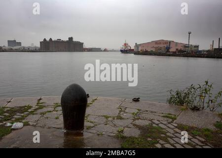 Looking across the East Float dock in Birkenhead, part of the Wirral Waters development on the banks of the river Mersey. Wirral Waters will form part of the Liverpool City Region Freeport, which was announced recently by the Conservative government. Stock Photo