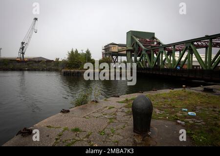 Looking across the East Float dock in Birkenhead, part of the Wirral Waters development on the banks of the river Mersey. Wirral Waters will form part of the Liverpool City Region Freeport, which was announced recently by the Conservative government. Stock Photo